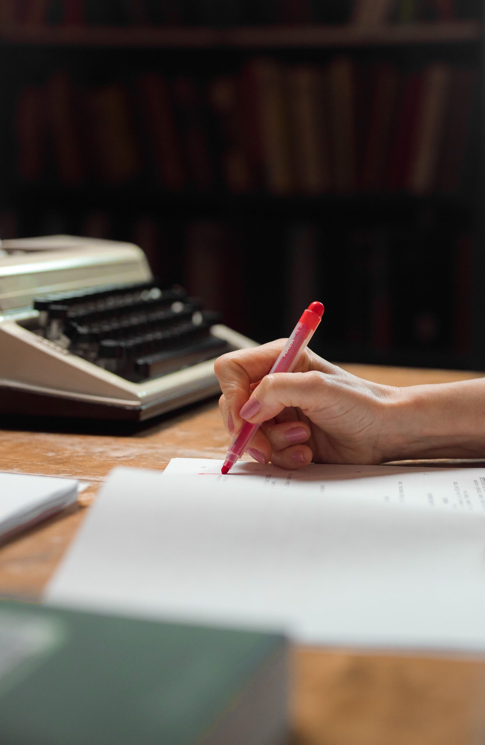 vintage typewriter with red pen